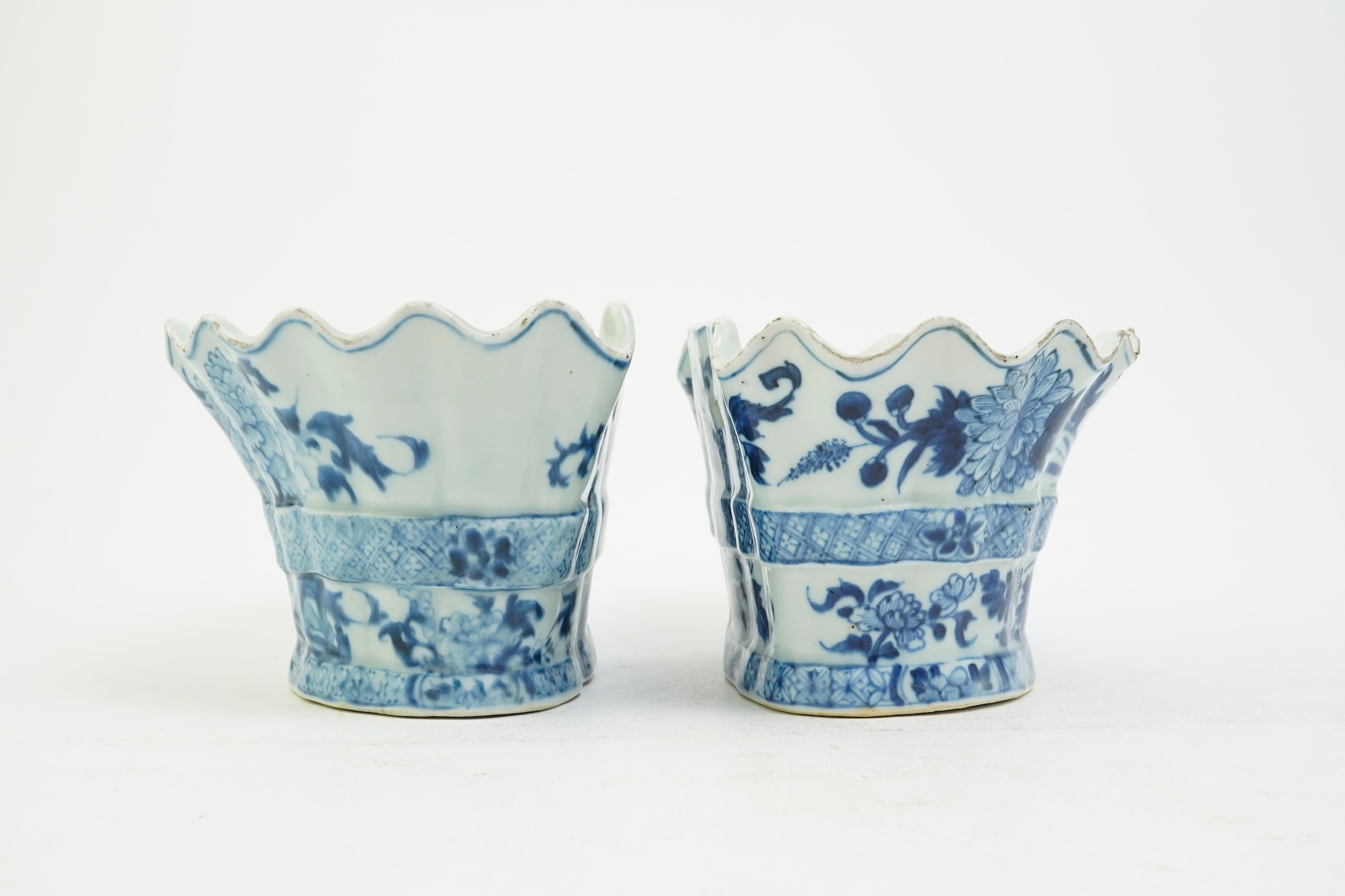 A pair of unusual Chinese export blue and white bough pots, after a Delft model, Qianlong period